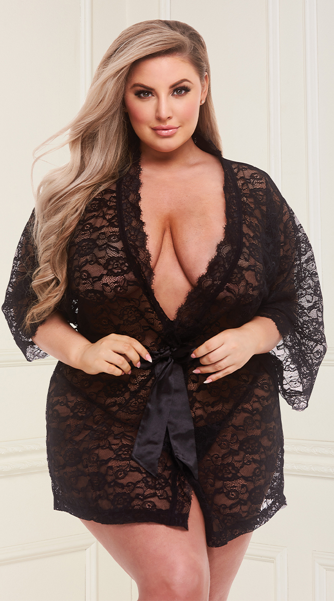 blonde curvy woman wearing a black short robe for a boudoir outfit